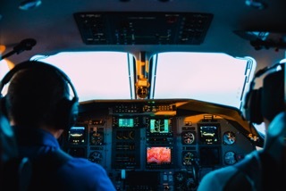 Two pilots in airplane cockpit